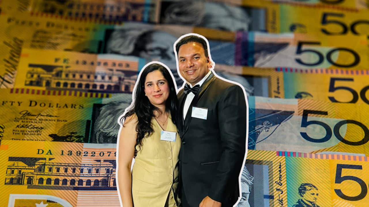 Indian-origin Adelaide-based couple Abhinav Kashyap and Beerpal Kaur standing in front of a background displaying endless dollar notes