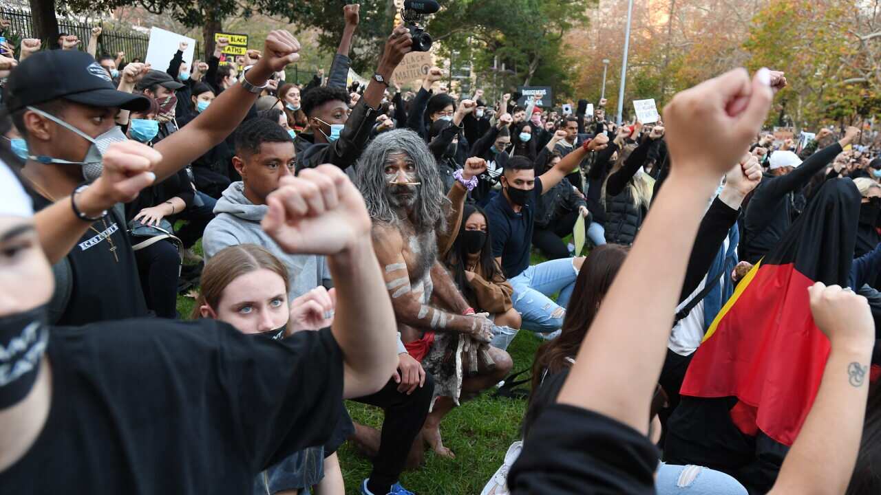 Protesters participate in a Black Lives Matter rally in Sydney, Saturday, June 6, 2020. A protest against the deaths of Aboriginal people in custody and solidarity with the US protests for George Floyd. (AAP Image/Dean Lewins) NO ARCHIVING