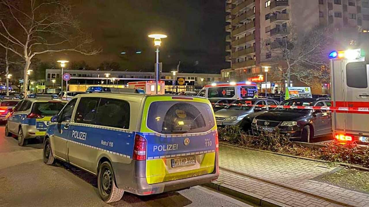 Police and ambulances at the crime scene after a shooting in Hanau near Frankfurt am Main, Germany