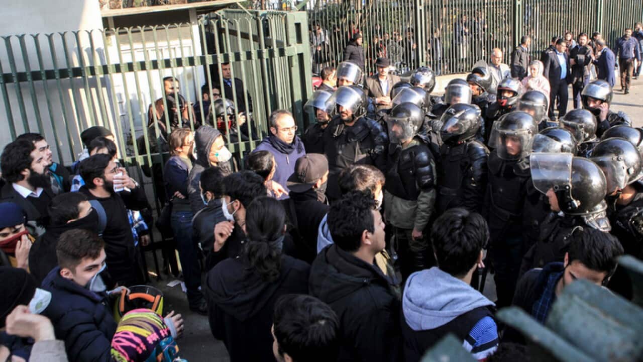 Iran, anti-riot Iranian police prevent university students to join other protesters over Iran weak economy, in Tehran, Iran.