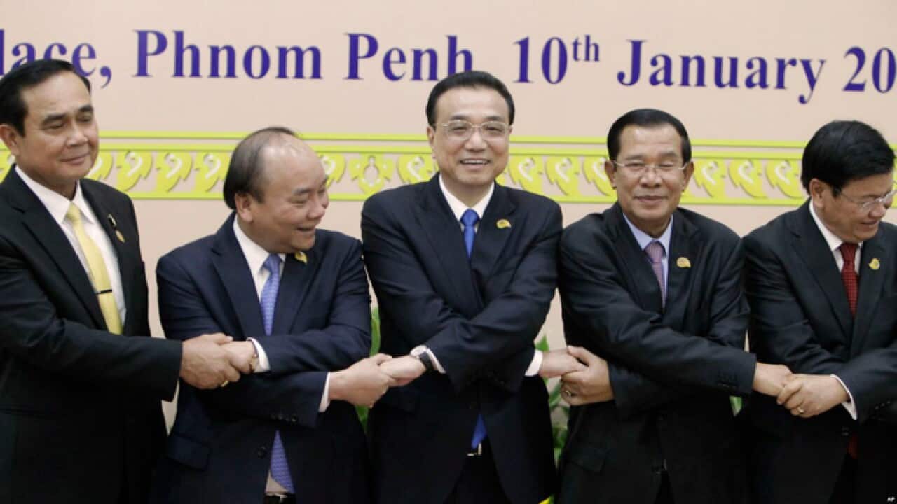China's Premier Li Keqiang, center, shakes hands with his counterparts from Vietnam, Thailand, Cambodia, Laos, at the 2nd Mekong Lancang Cooperation Summit.