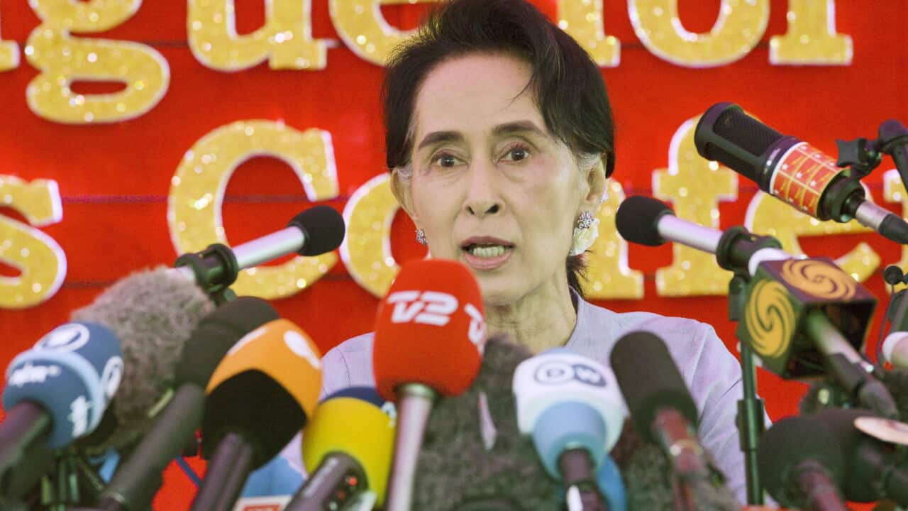 Myanmar's opposition leader Aung San Suu Kyi speaks at a new conference in the Myanmar's largest city Yangon