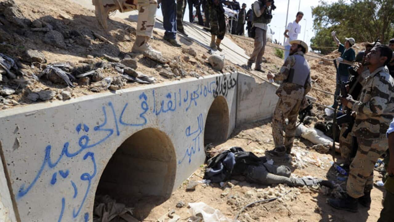 gaddafi_drain_221011_b_getty_1285288371