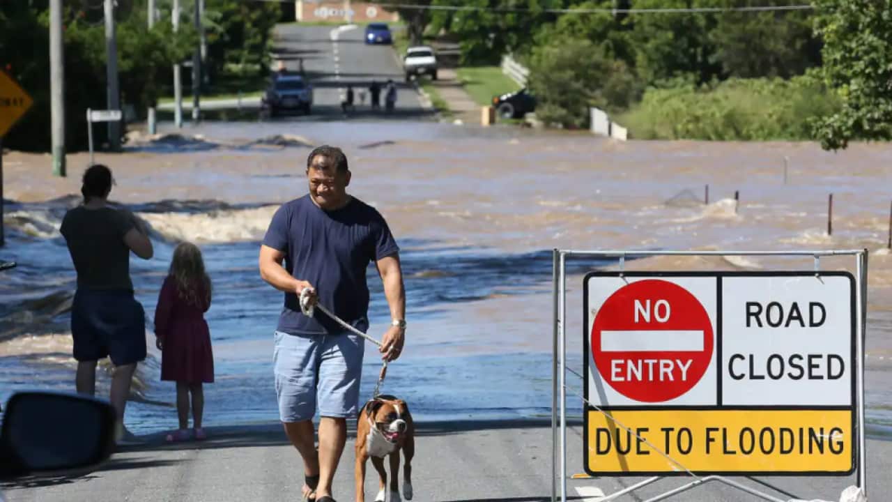 Flooded scenes in Logan, south of Brisbane, as the suburb reached its peak, Tuesday, 1 March, 2022.