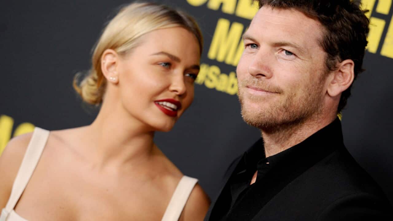 Sam Worthington (R) and Lara Bingle