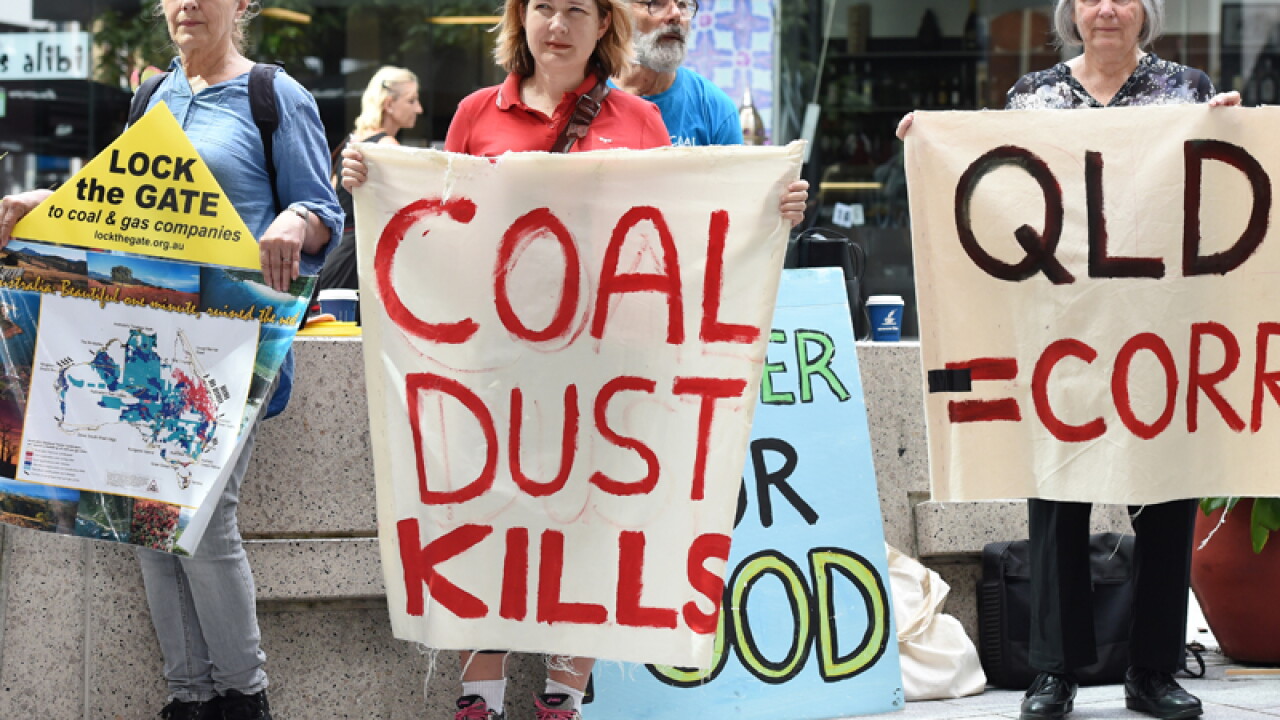 Anti-coal protesters outside the Magistrates Court in Brisbane