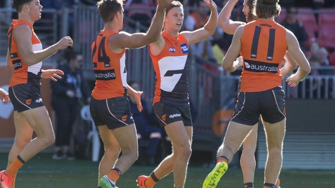 Lachie Whitfield of the Giants celebrates a goal