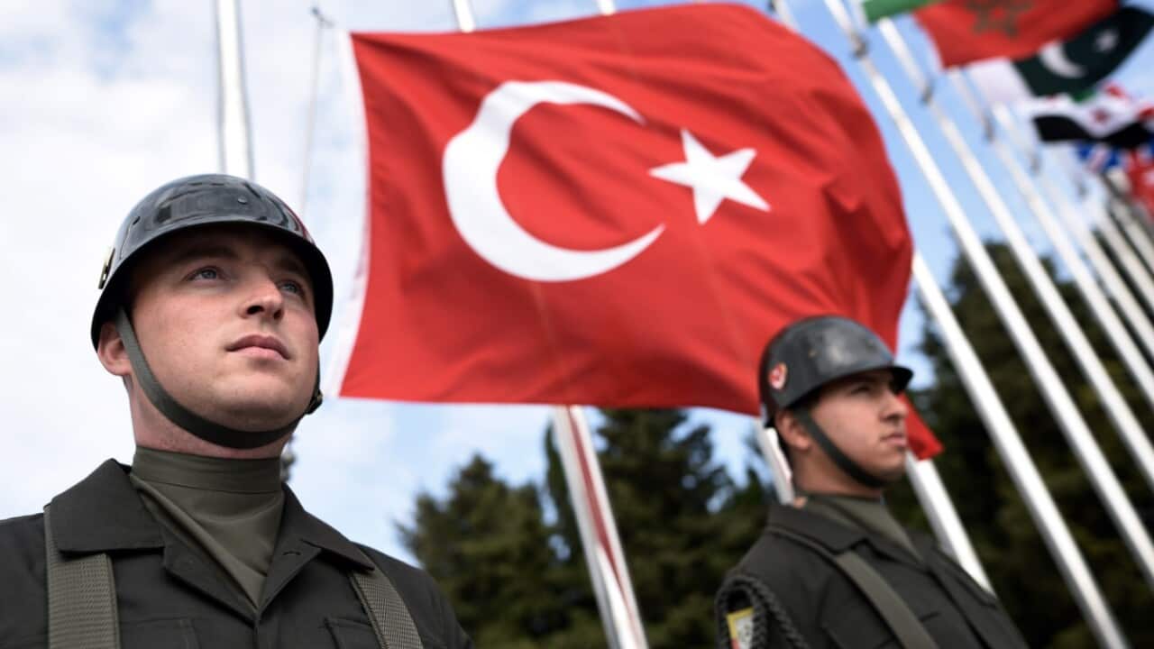 Turkish soldiers stand during the Turkish International Service at Mehmetcik Abide in the Gallipoli Peninsula, Turkey, Sunday, April 24, 2016.