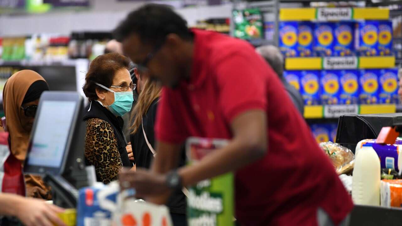 People shopping are seen in Woolworths supermarket in Coburg, Melbourne, Thursday, March 19, 2020.