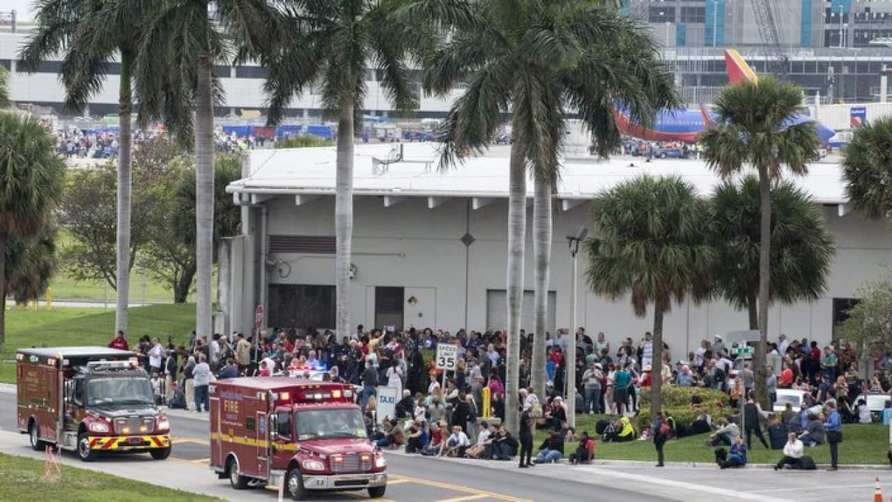 Firemen and ambulances wait outside the Fort Lauderdale's airport in Florida
