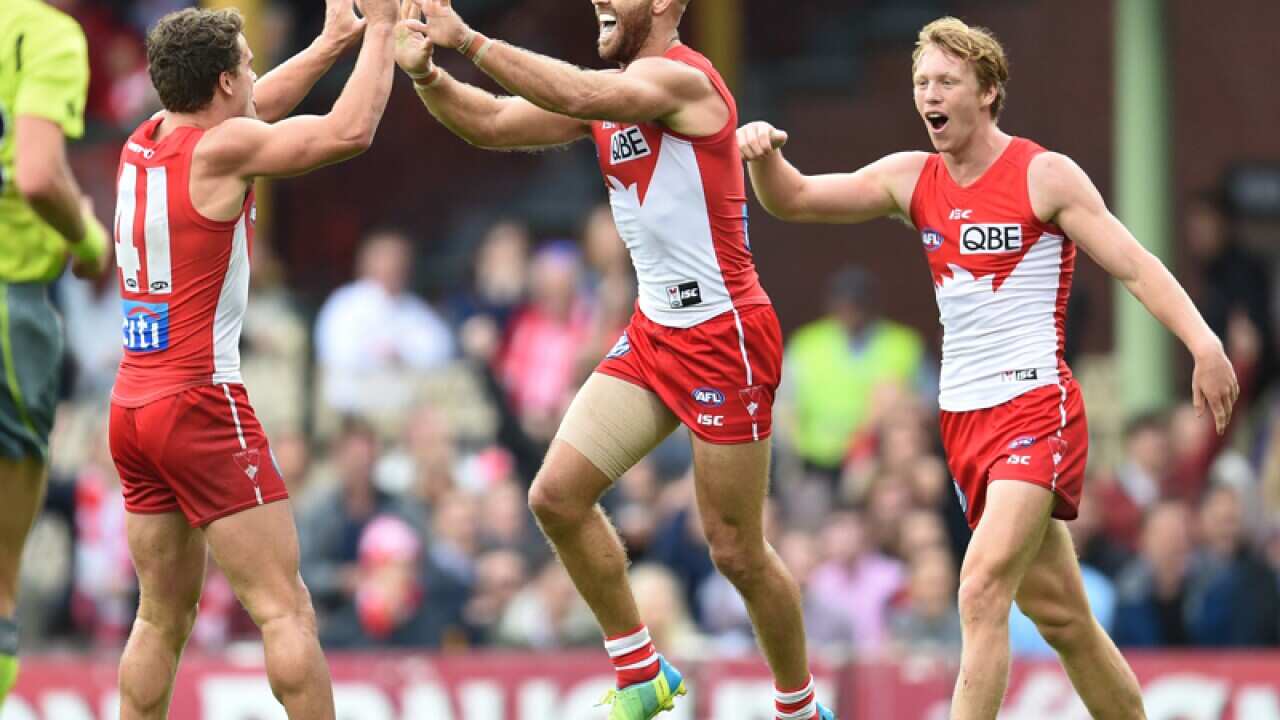 Jarrad McVeigh of the Swans celebrates