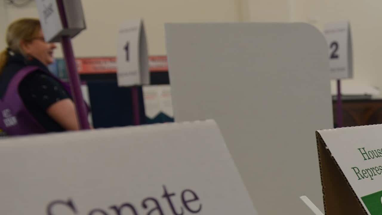People cast their votes at a polling station