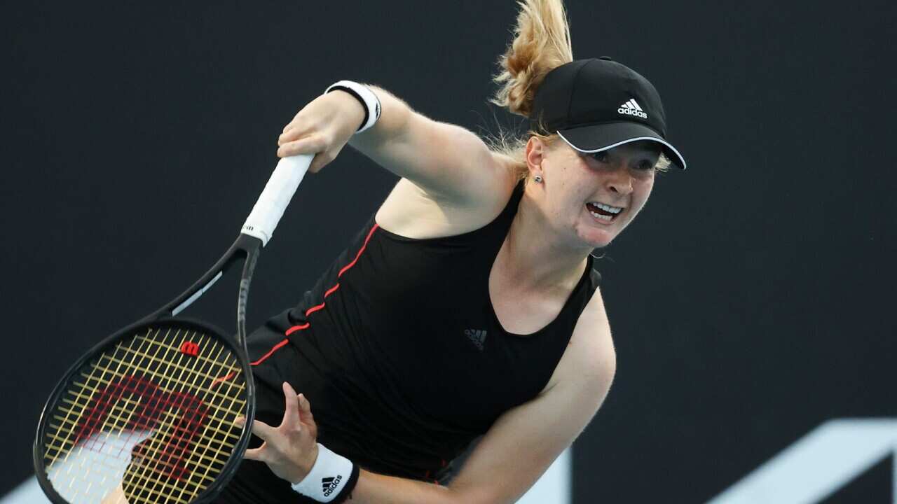 Britain's Francesca Jones serves to Shelby Rogers during their first round match at the Australian Open tennis championship on Feb. 9,2021.
