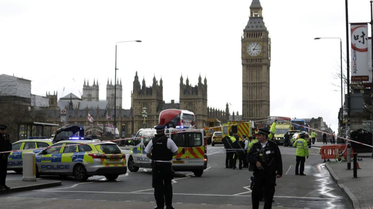 Police secure the area on the south side of Westminster Bridge
