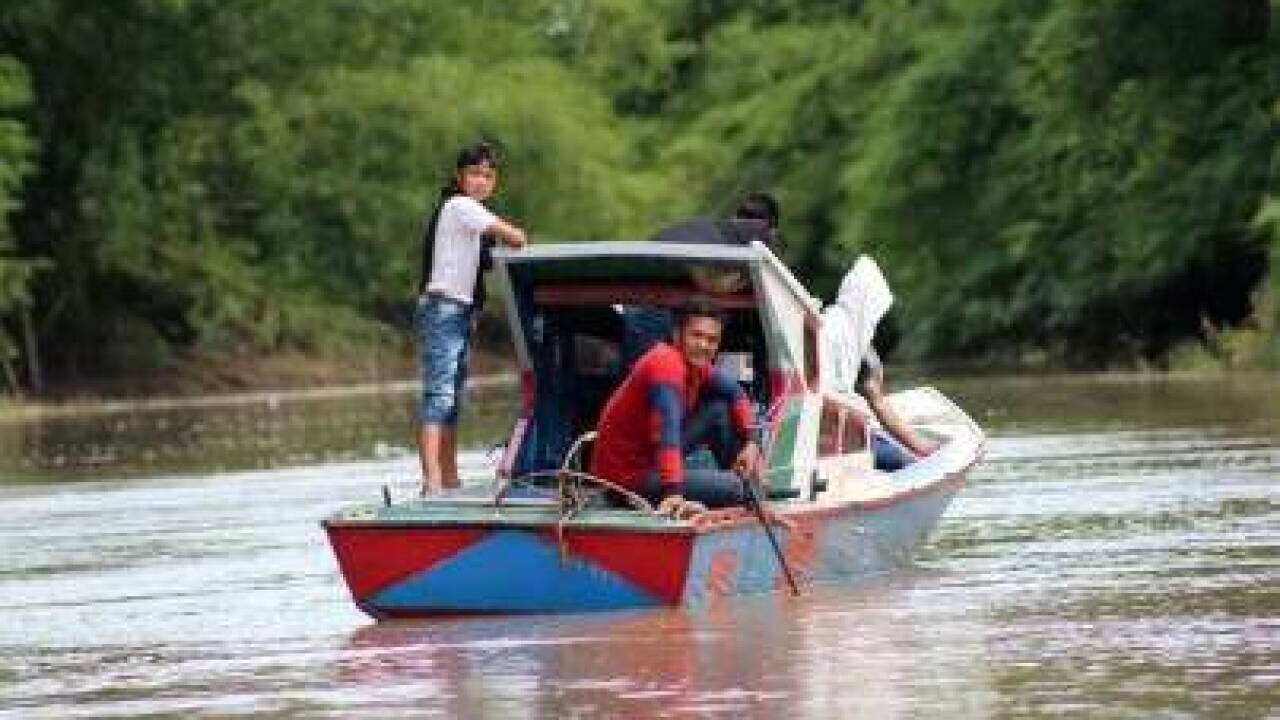 Residents undertake their activities on the Santan River, in the Kutai Kartanegara Regency of East Kalimantan.