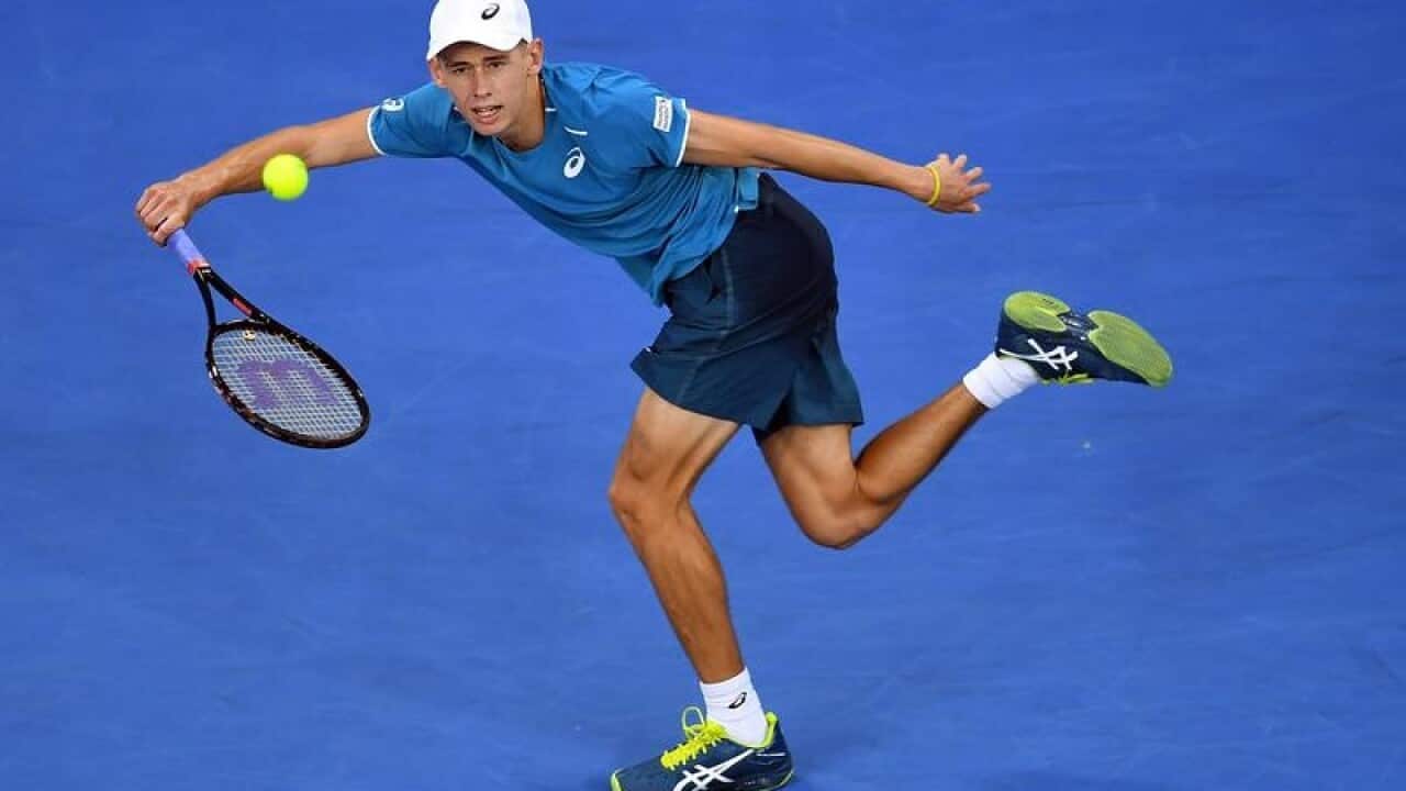 Alex de Minaur of Australia in action against Tomas Berdych.