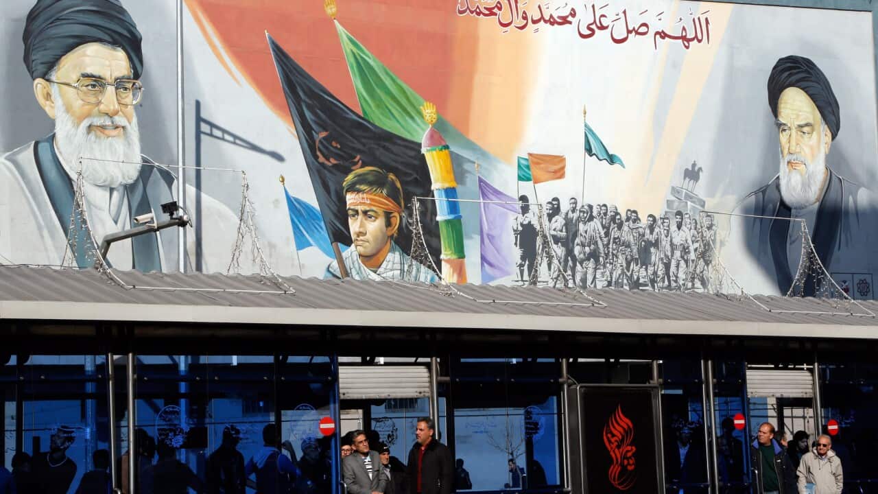Iranians wait at a bus station in a street of the capital of Tehran, Iran, 16 January 2016. (EPA/ABEDIN TAHERKENAREH)