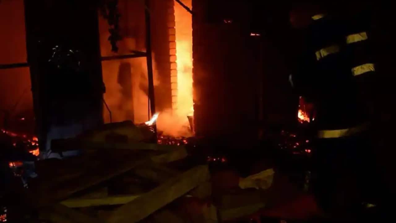 Firefighters and rescue crews battling fires in the aftermath of Russian rocket strikes on the Black Sea port city of Mykolaiv