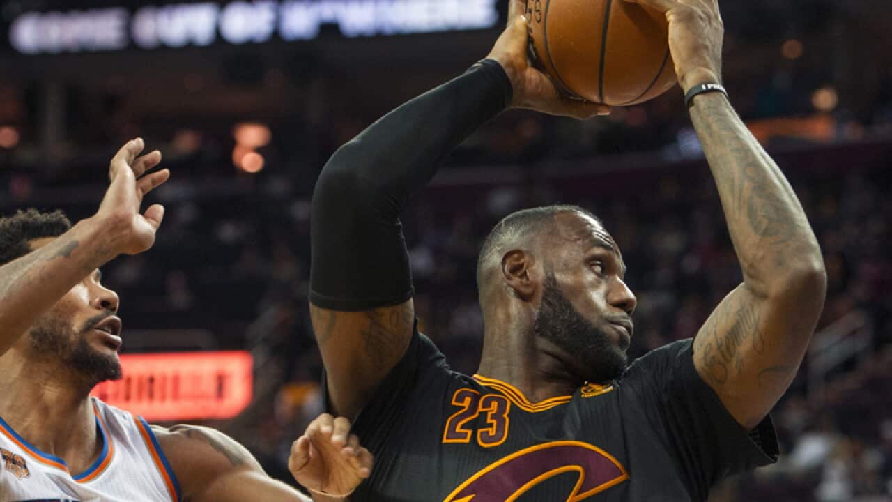 Cleveland Cavaliers' LeBron James (23) grabs a rebound