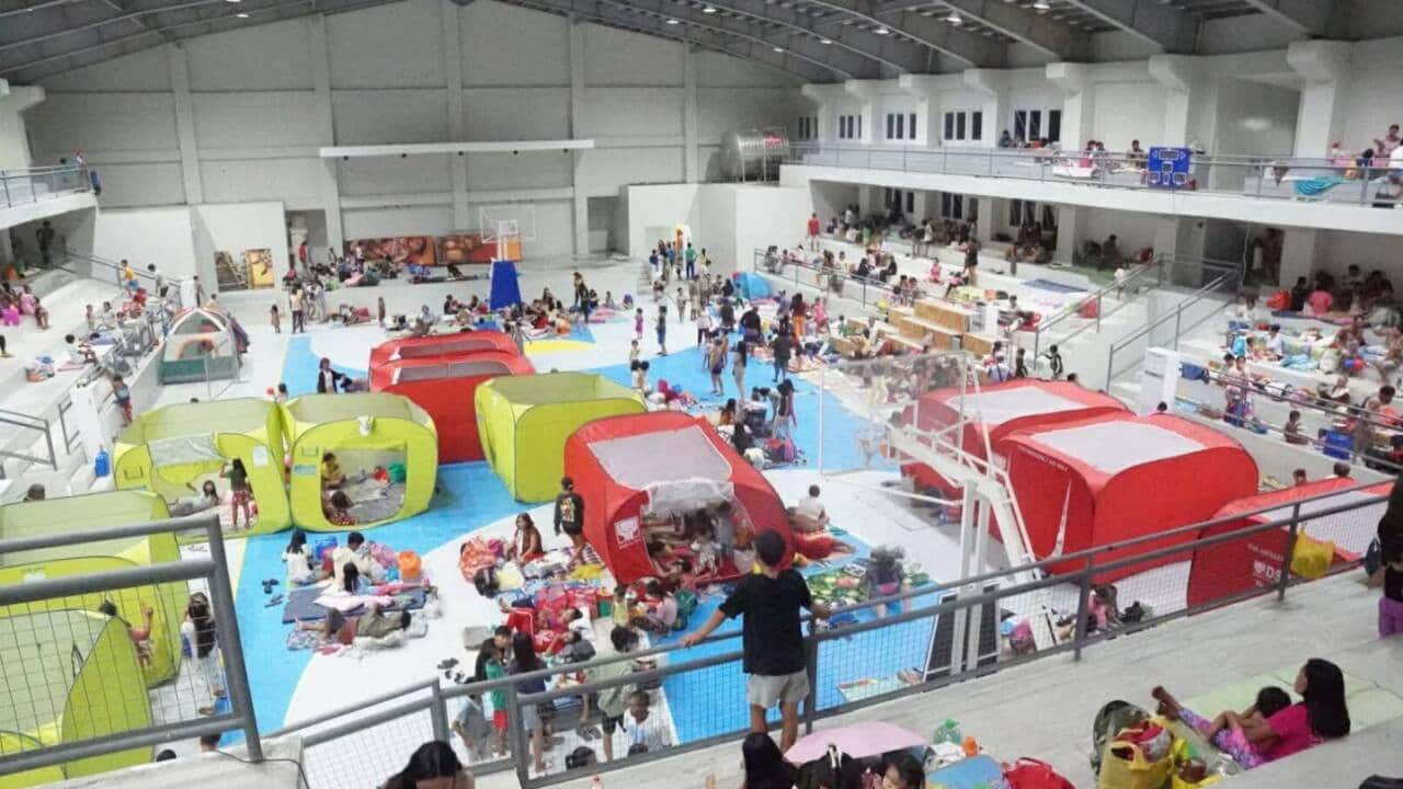Albay residents take shelter at the Polangui gymnasium on Thursday night as part of preemptive measures ahead of the expected impact of Severe Tropical Storm Opong.