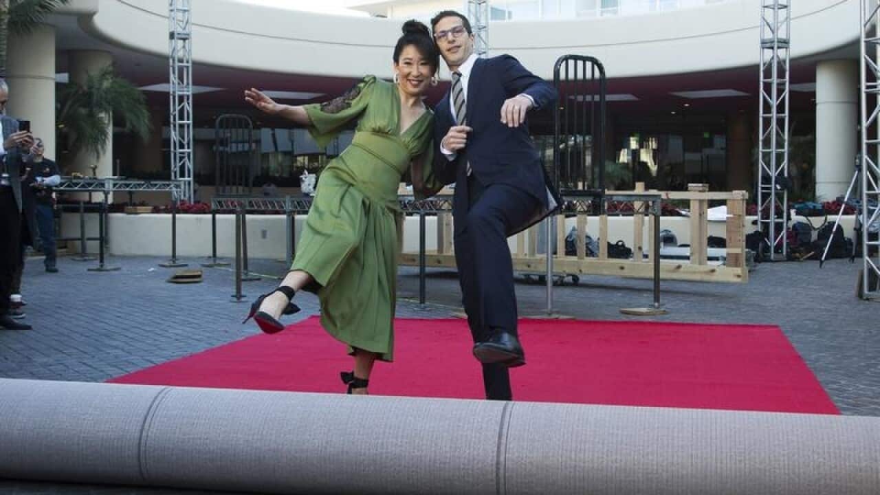 Sandra Oh and Andy Samberg rolling out red carpet