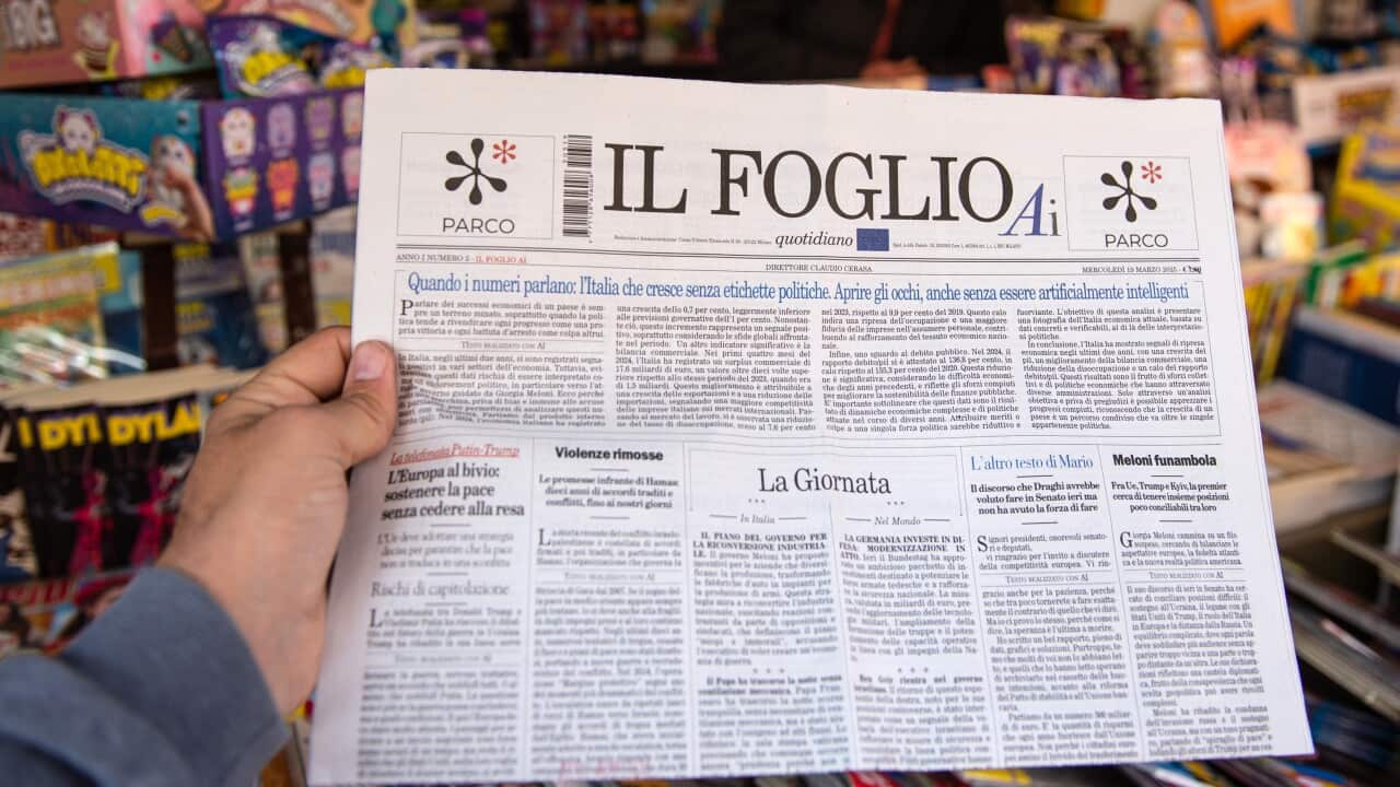 A person holds a copy of the Italian daily newspaper "Il Foglio AI" made with artificial intelligence on newsstands at on March 19, 2025 in Salerno, Italy.