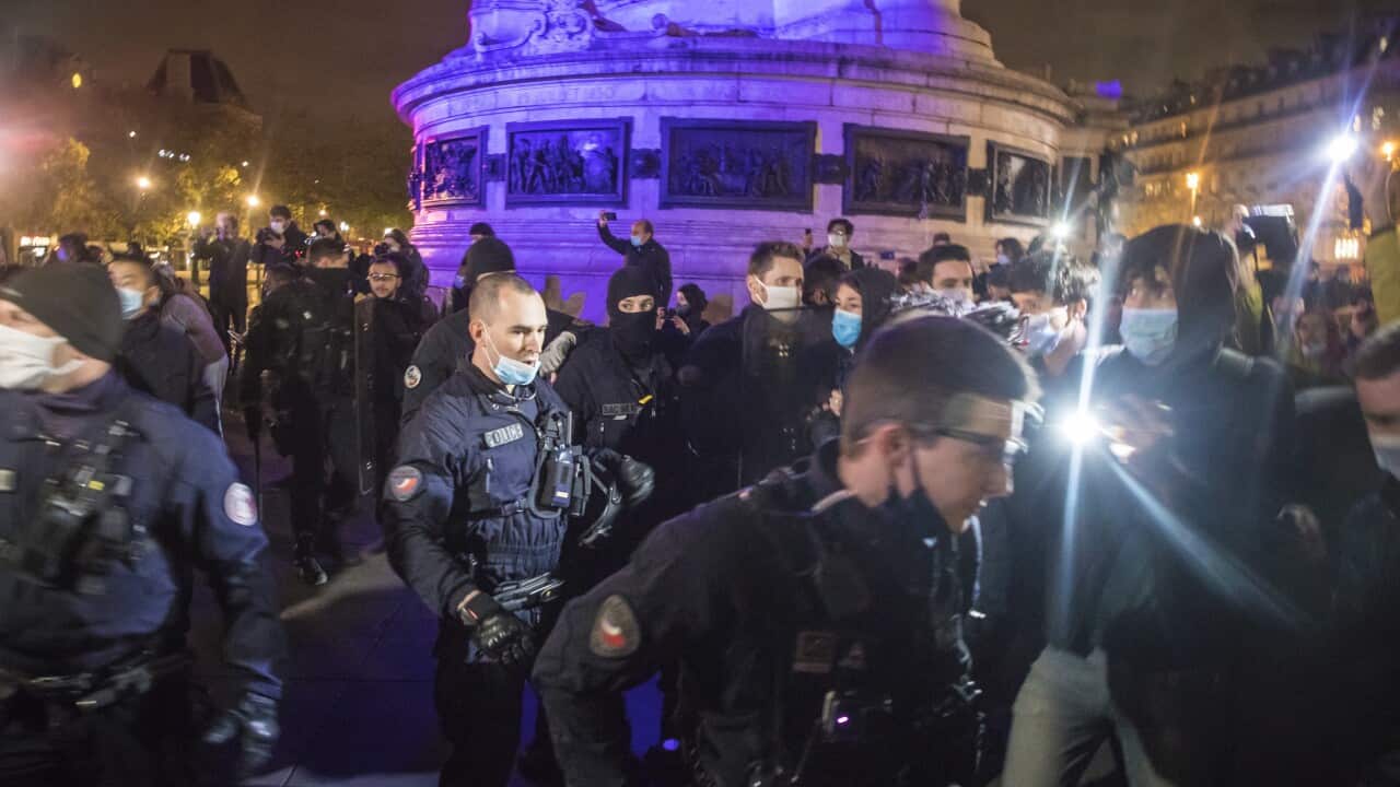 French police officers evacuate migrants with their tents from a new migrant camp in Paris’ Place de la Republique.