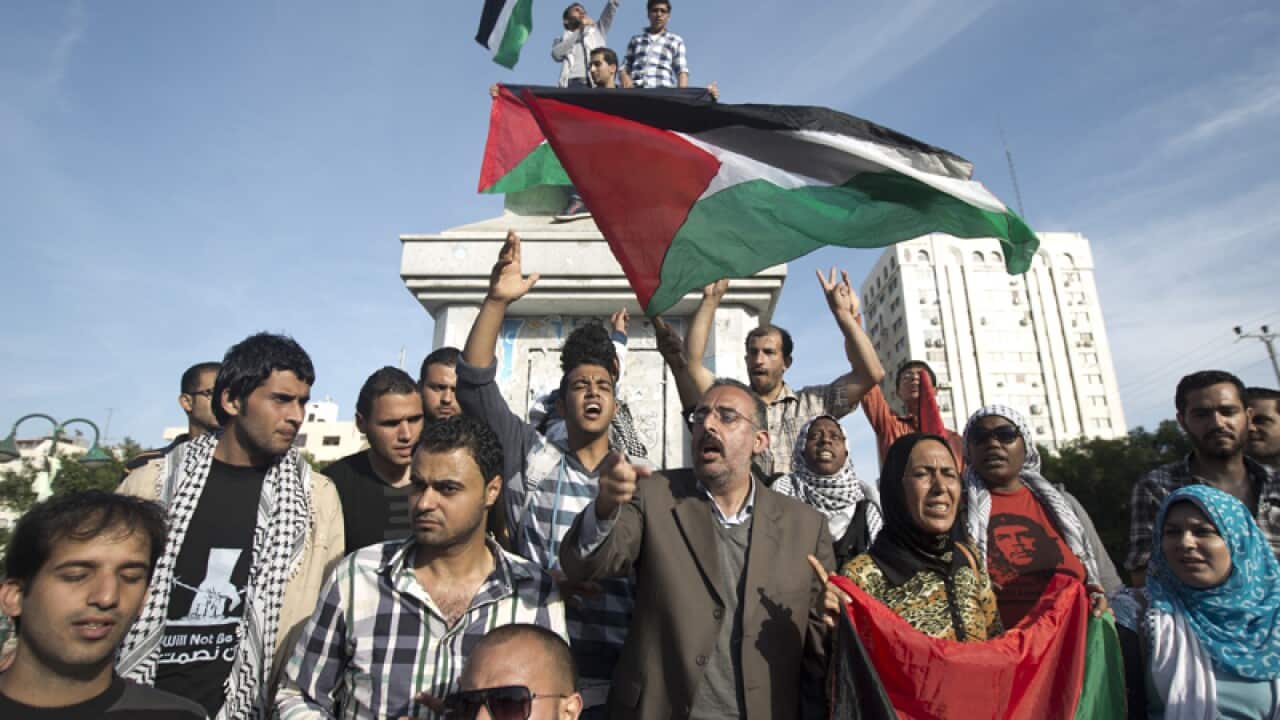 Palestinians celebrate the agreement to form a unity government