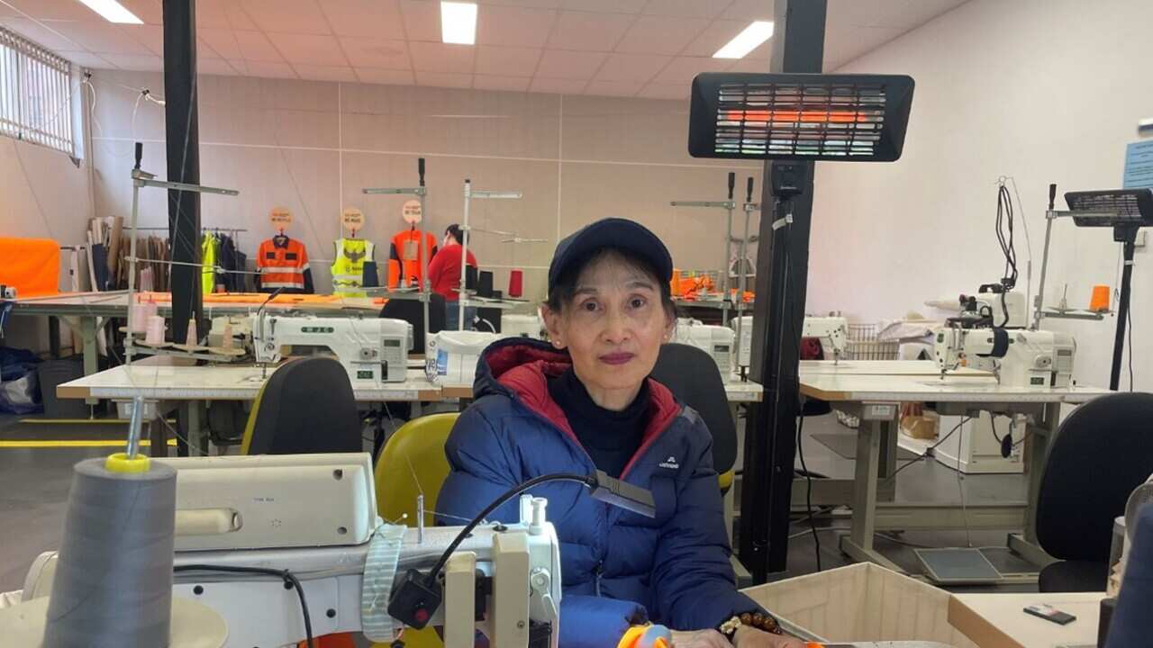 Thi Le working on the hi-viz vests.jpg