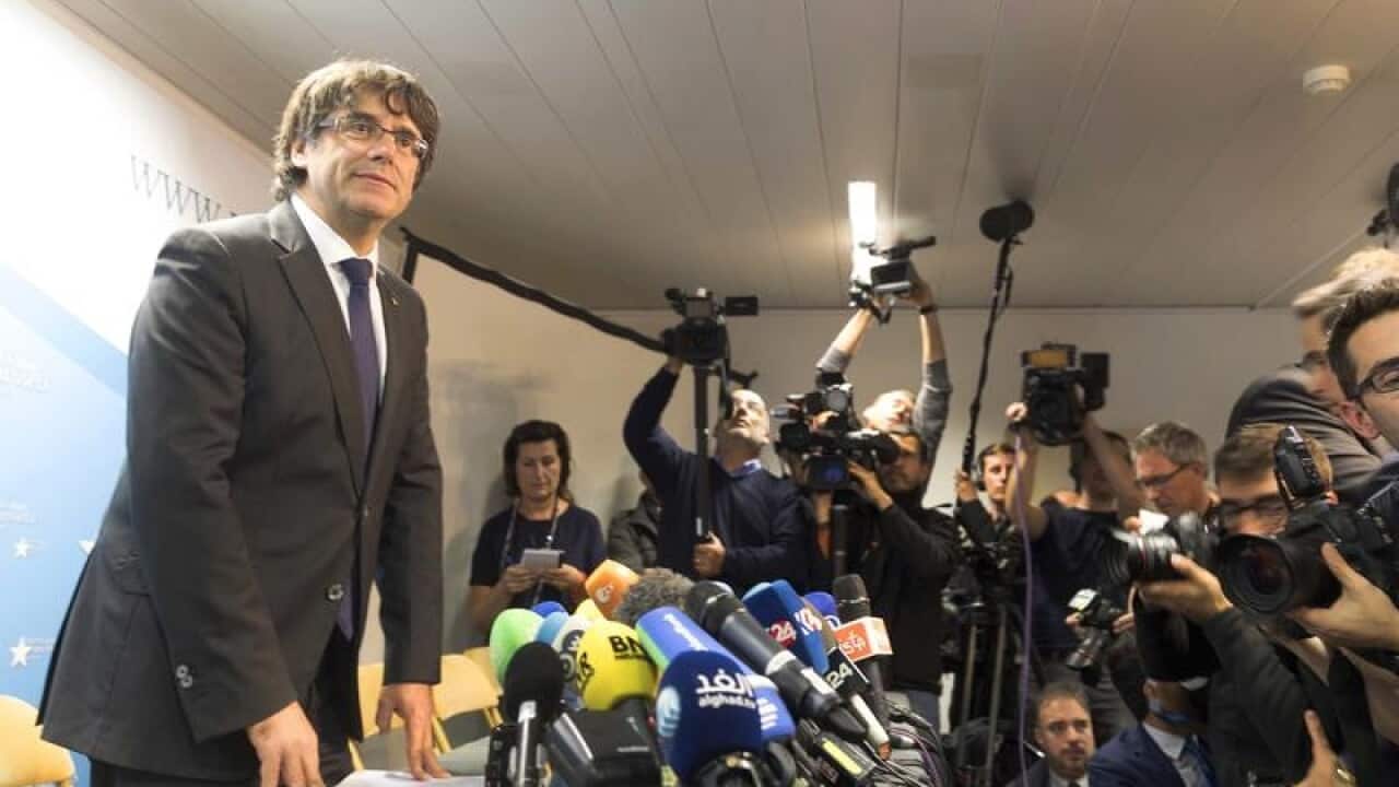 Carles Puigdemont looks on after a press conference in Brussels
