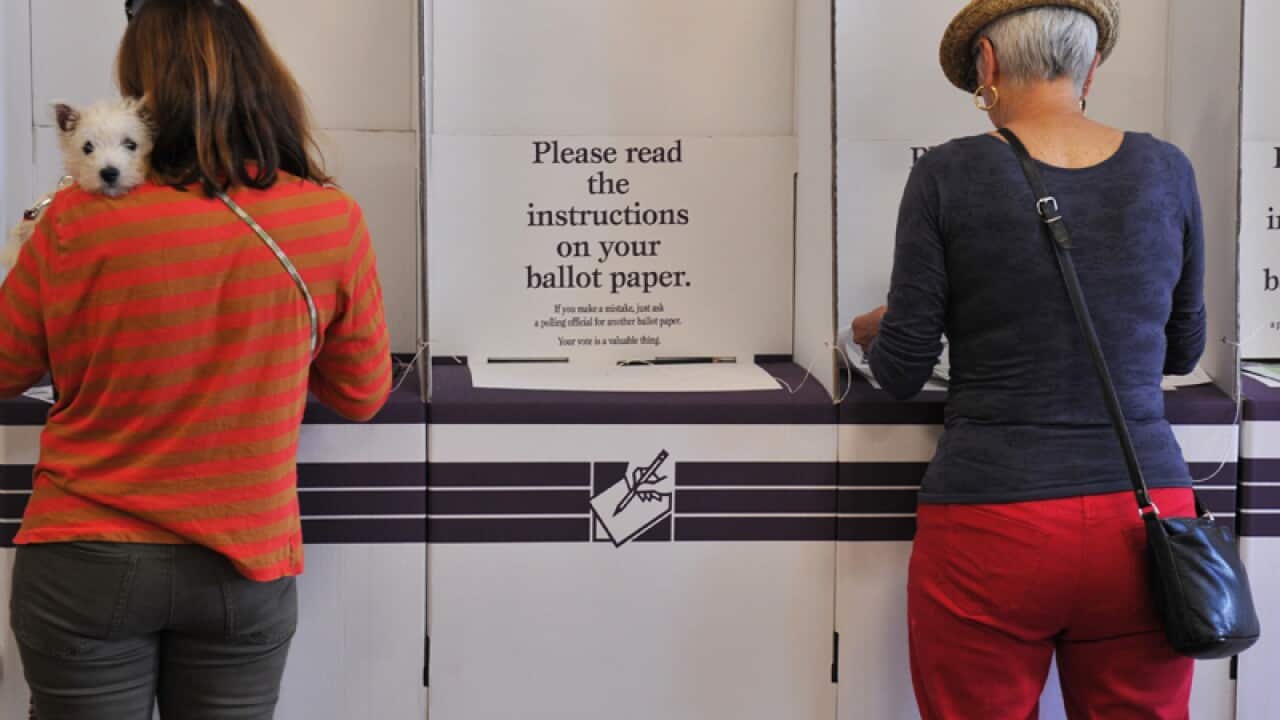Voters cast their vote