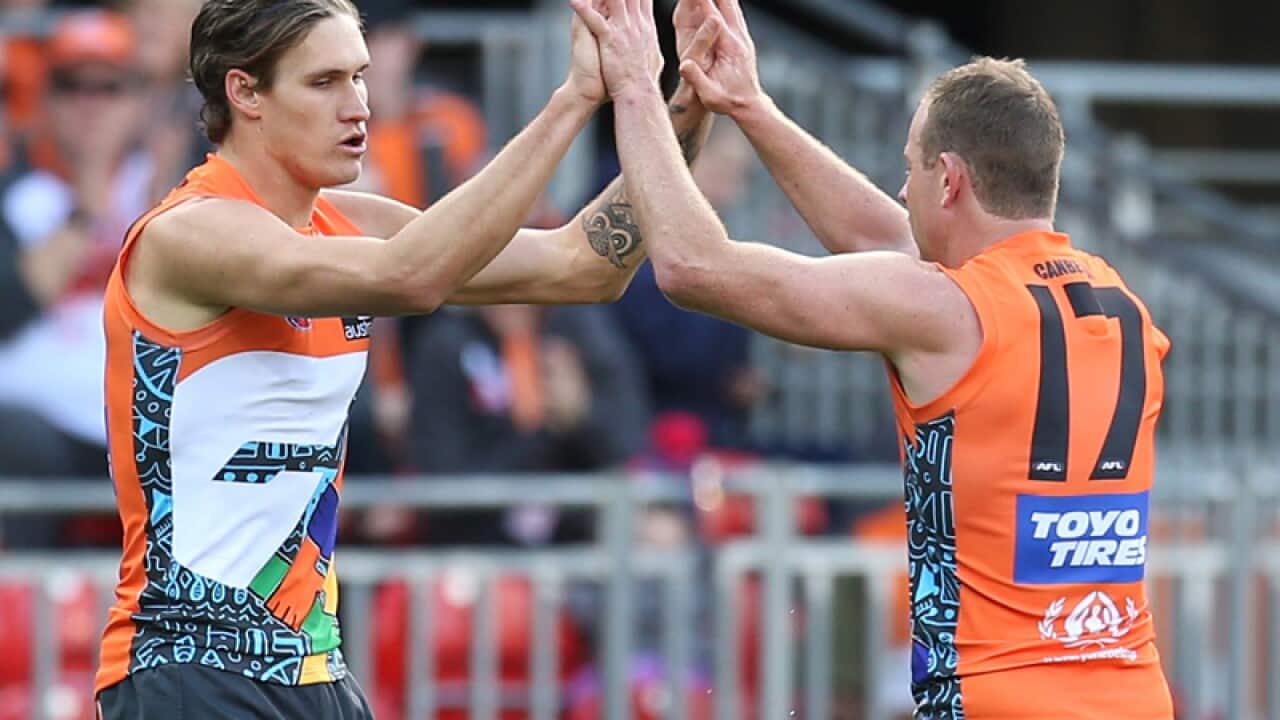 Rory Lobb (L) of the Giants celebrates