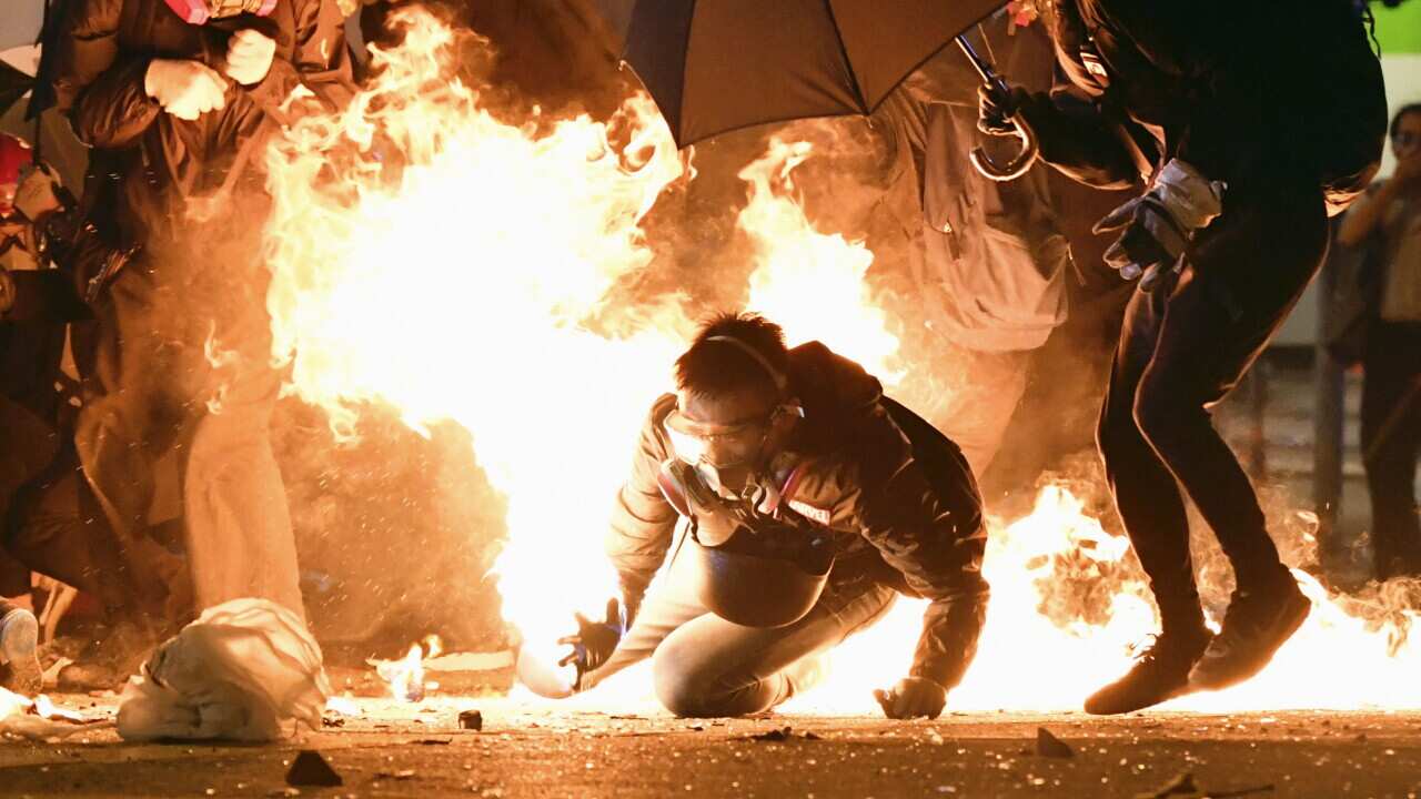Clashes between protesters and police continue near the Hong Kong Polytechnic University in Kowloon district.