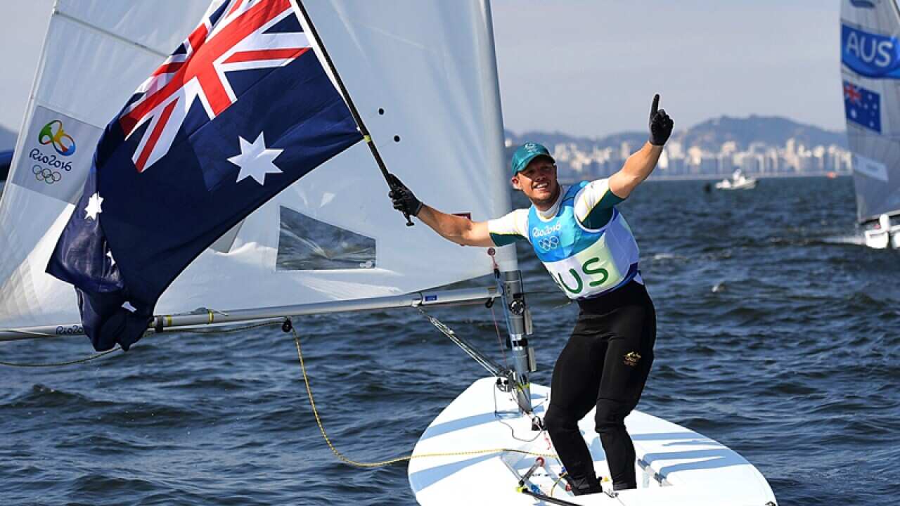 Australian sailor Tom Burton celebrates gold in the Mens Laser in Rio