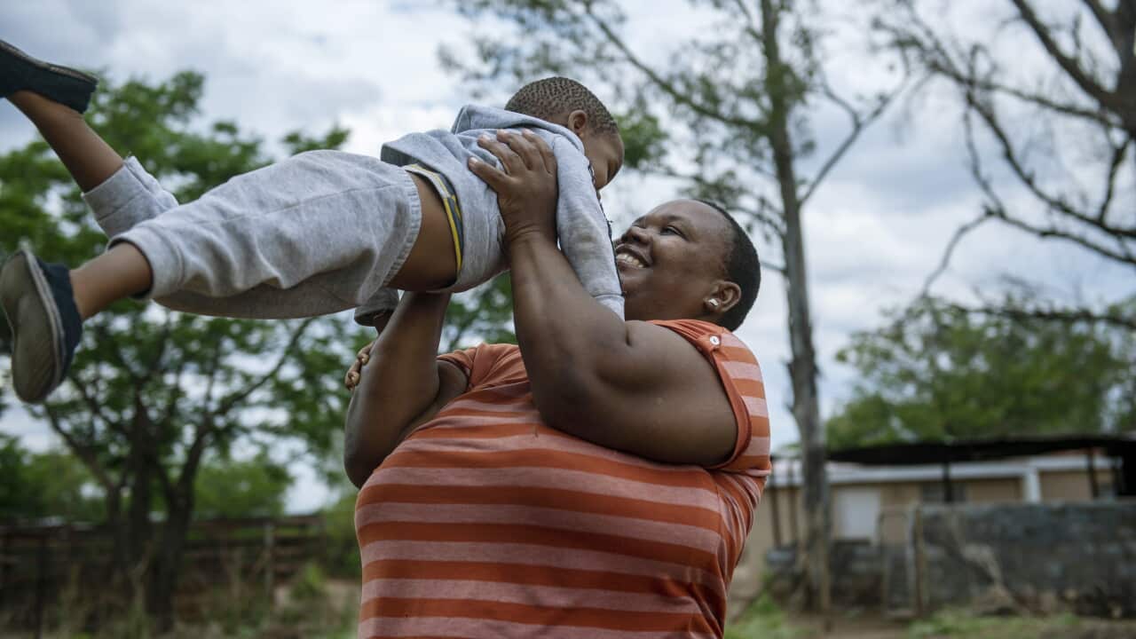 Dora with her son in Botswana