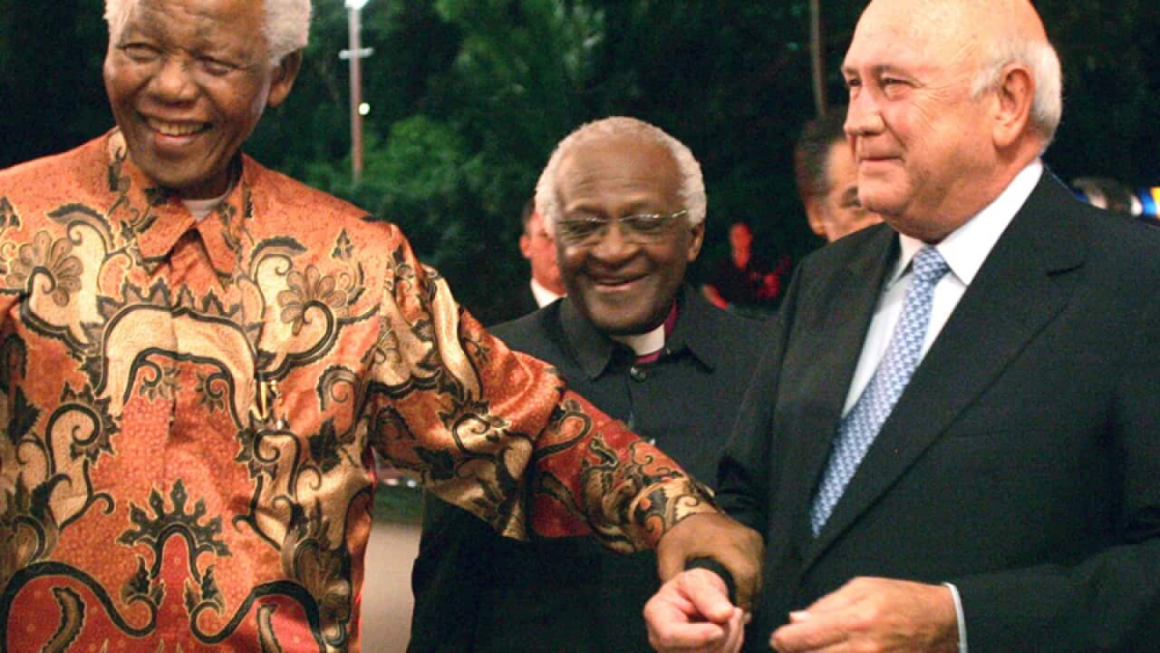 Nelson Mandela, left, and FW de Klerk, right, with Desmond Tutu