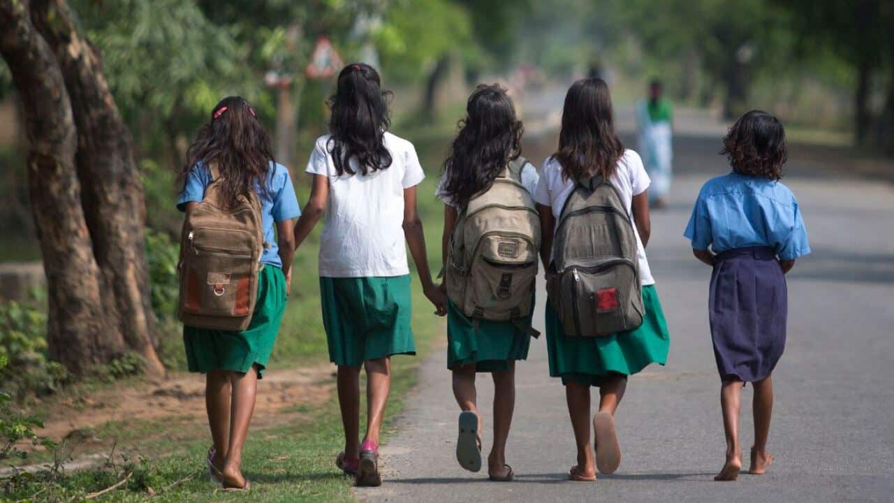 Indian girls walk to school
