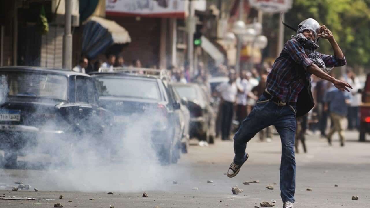 Morsi loyalists, foes clash in Cairo