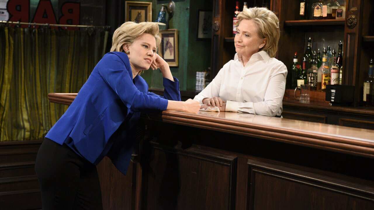 Kate McKinnon, left, portraying Hillary Rodham Clinton, and Hillary Rodham Clinton, right, portraying Val, appear during the "Bar Talk" sketch on "Saturday Night Live," in New York. (AP)
