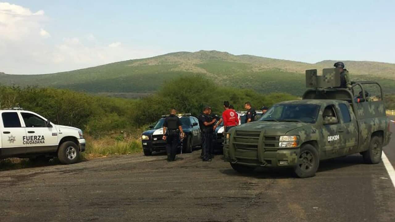 Federal police at the scene of fighting in western Mexico