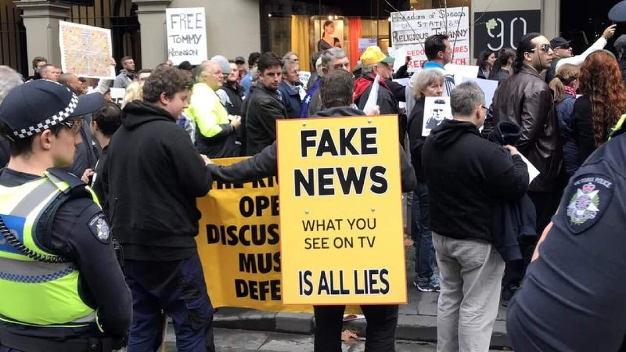 Protesters and police at a rally