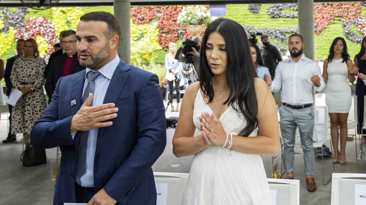 (L to R) Danny and Leila Abdallah pray during the launch of i4give Day
