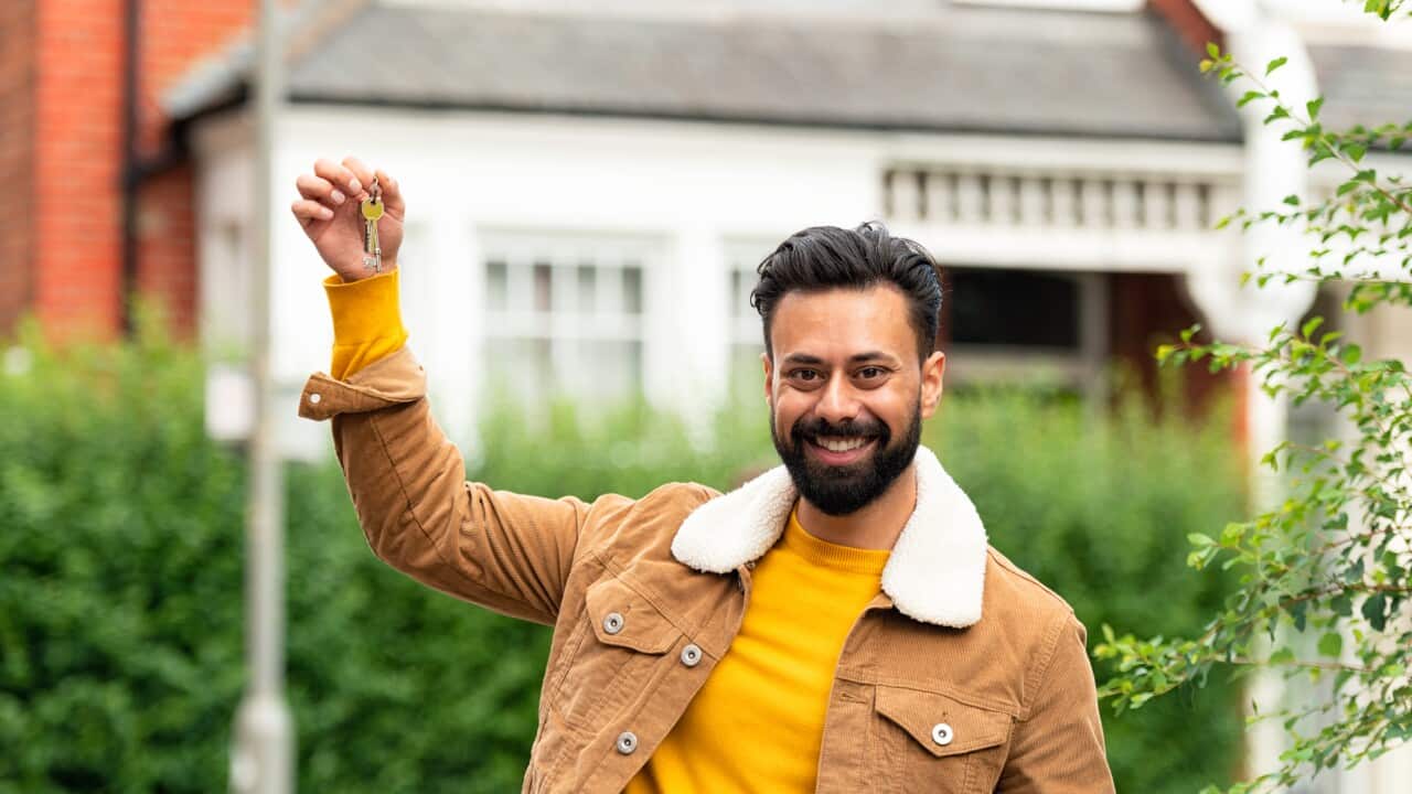 Success - Holding up house keys