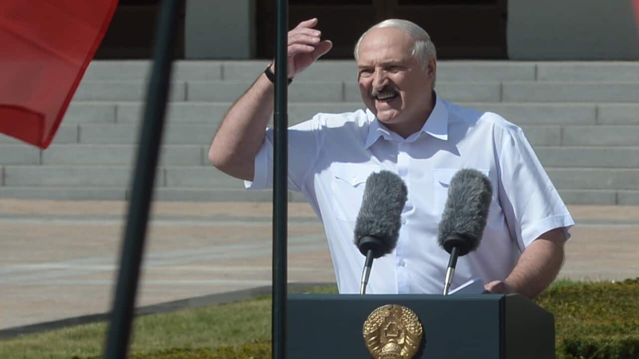 Belarusian President Alexander Lukashenko addresses his supporters during a rally in Minsk