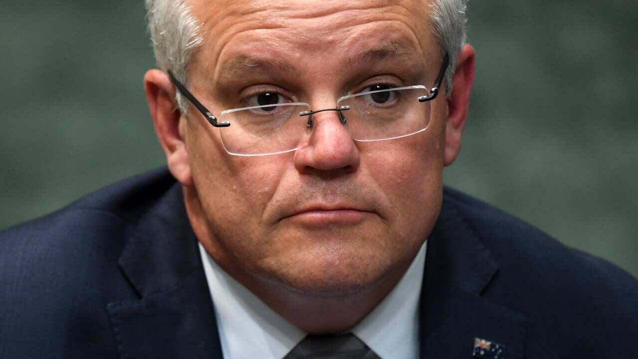 Prime Minister Scott Morrison reacts during House of Representatives Question Time at Parliament House in Canberra.