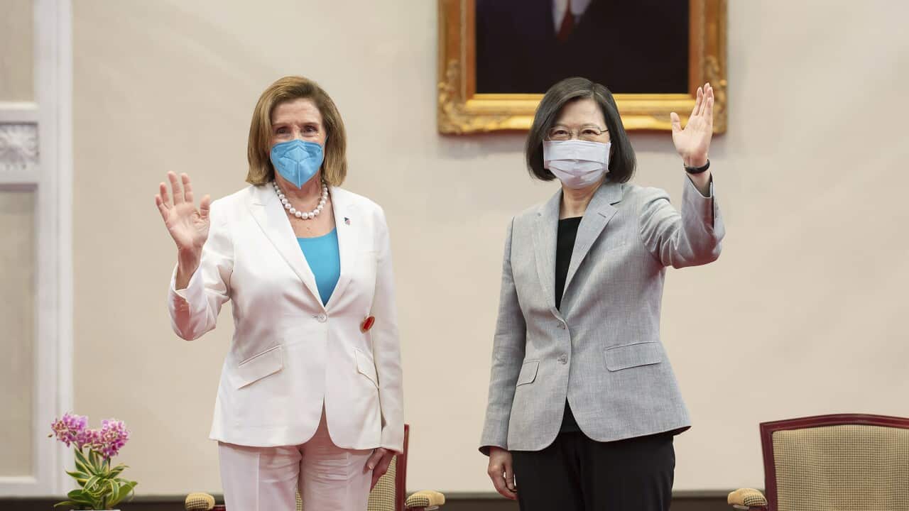 In this photo released by the Taiwan Presidential Office, U.S. House Speaker Nancy Pelosi, left, and Taiwanese President President Tsai Ing-wen wave during a meeting in Taipei, Taiwan, Wednesday, Aug. 3, 2022. U.S. House Speaker Nancy Pelosi, meeting top officials in Taiwan despite warnings from China, said Wednesday that she and other congressional leaders in a visiting delegation are showing they will not abandon their commitment to the self-governing island. (Taiwan Presidential Office via AP)