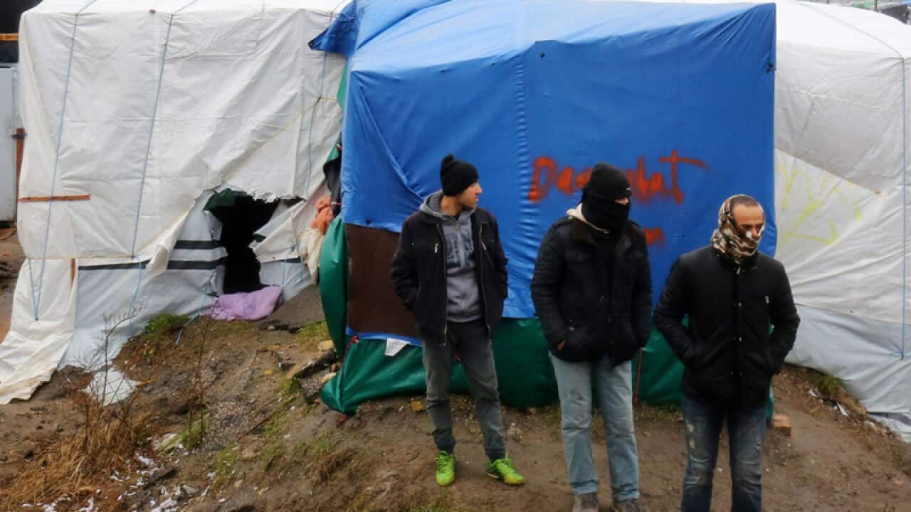 Migrants in the Calais migrant camp.