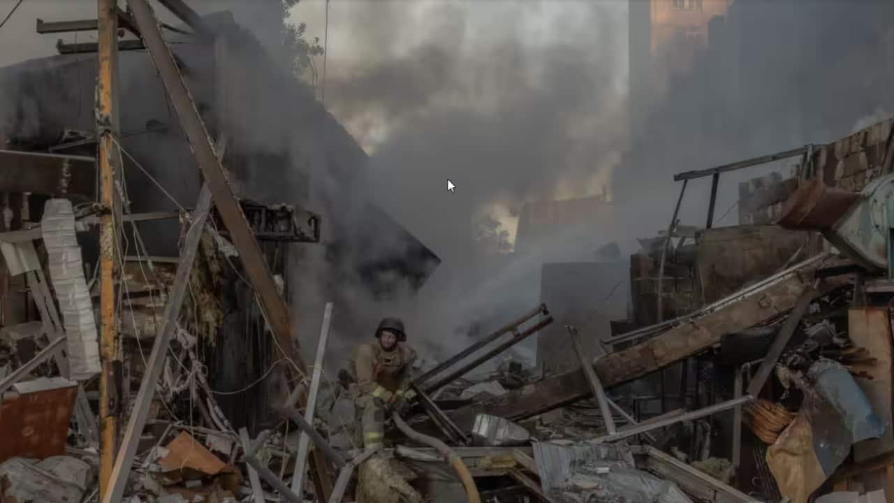 It's believed a Russian missile hit a 24-storey building, triggering its collapse..png