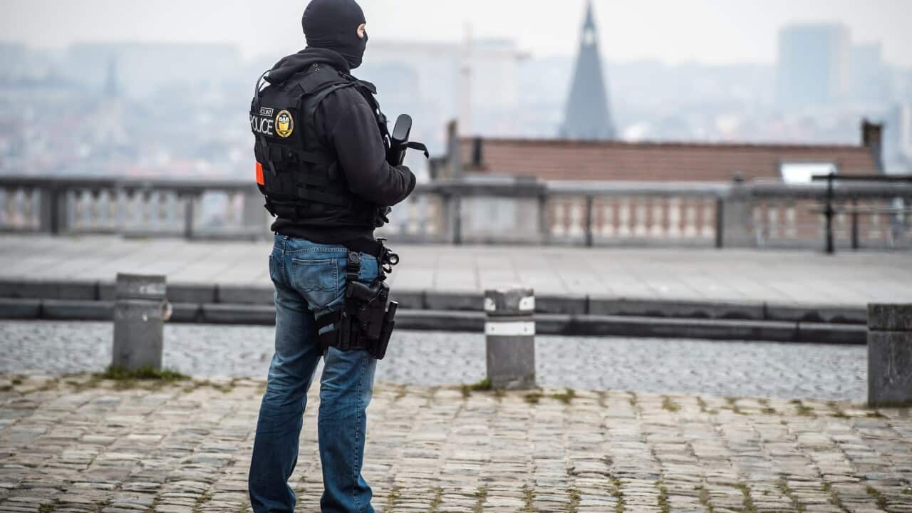 A police officer stands guard