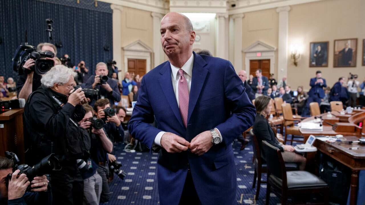 Ambassador Gordon Sondland departs from the Impeachment hearing room